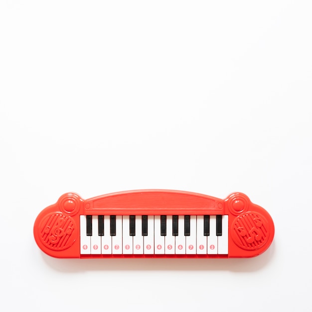 Piano toy on white background with copy space