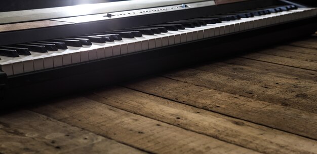 piano on wooden background closeup ,concept musical instruments