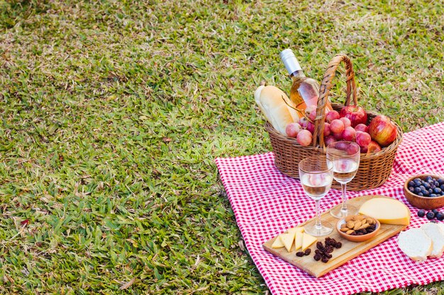 Picnic basket on kitchen cloth with copy space