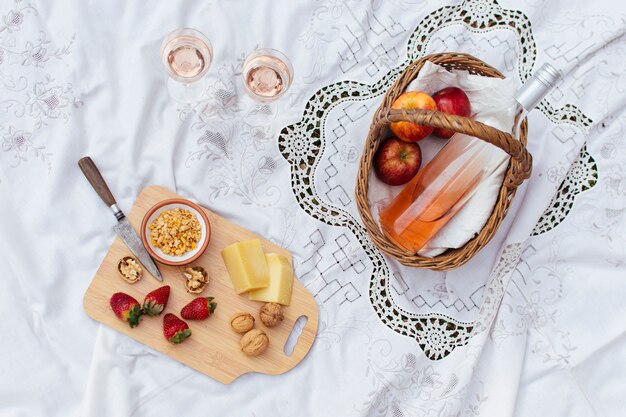 Picnic basket on white cloth