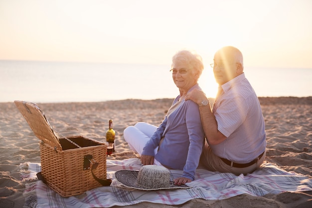 Picnic on the beach on the sunset