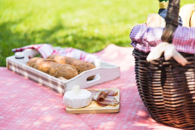 Picnic breakfast on table cloth in the grass