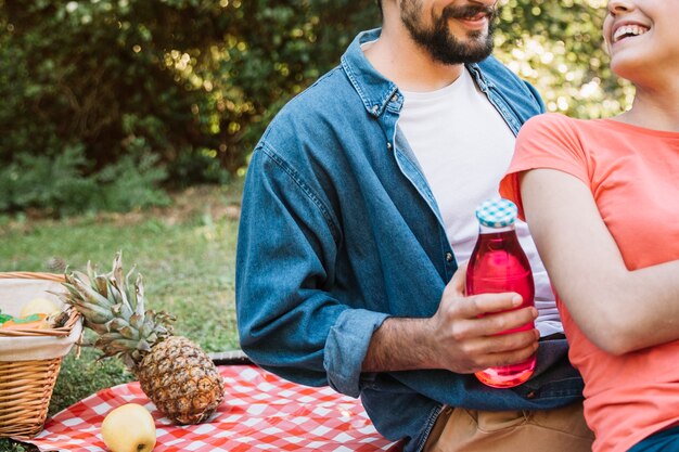 Picnic concept with couple and juice