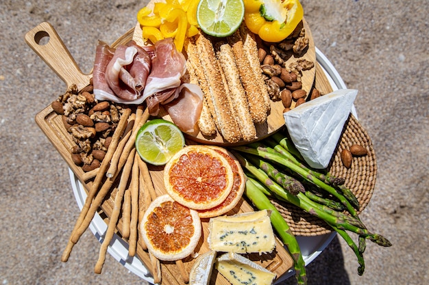 Picnic with delicious beautiful food on the table. The view from the top. The concept of a holiday.