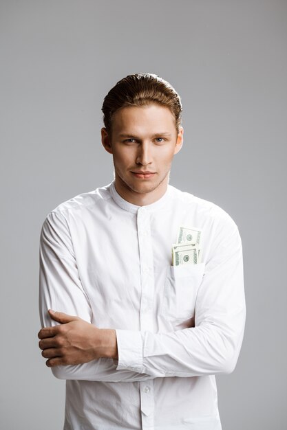 Picture of attractive caucasian man with money in a pocket