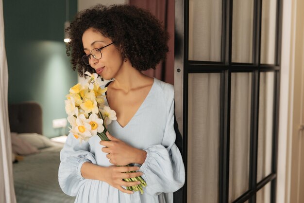 Picture of charming woman with beautiful flowers