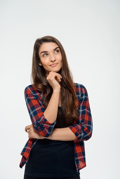 Picture of cheerful young girl dressed in plaid shirt