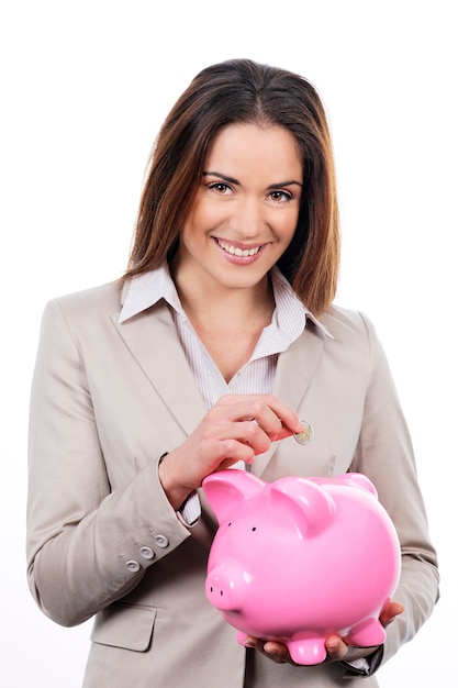 Picture of lovely woman with piggy bank and money