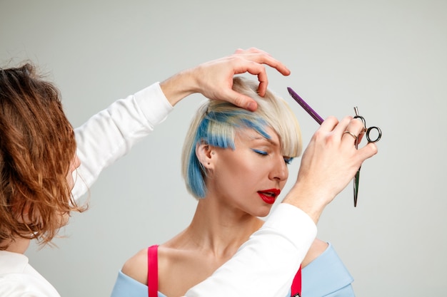 Picture showing adult woman at the hair salon.