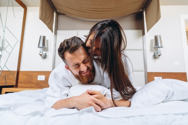 Picture showing happy couple resting in hotel room