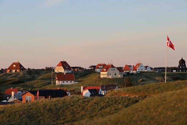 Picturesque scene of white houses on the hill in Lonstrup, Denmark