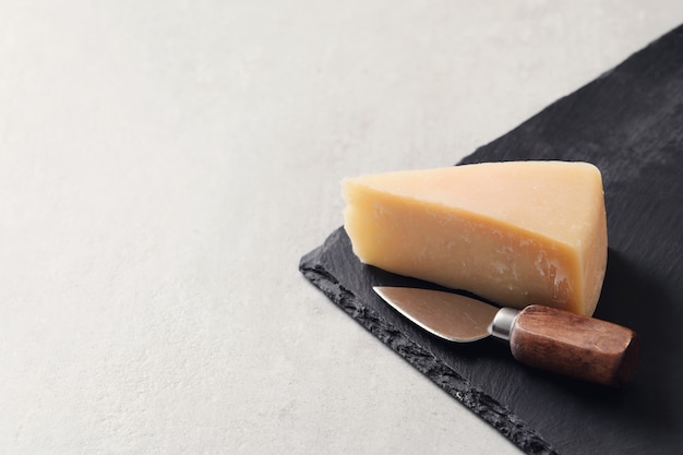 Piece of cheese on a tablecloth