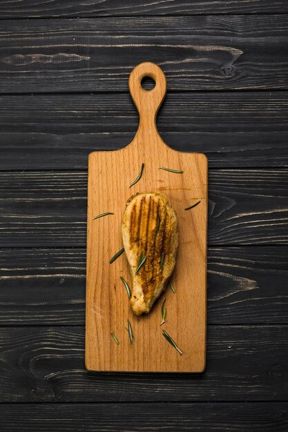 Piece of chicken on cutting board