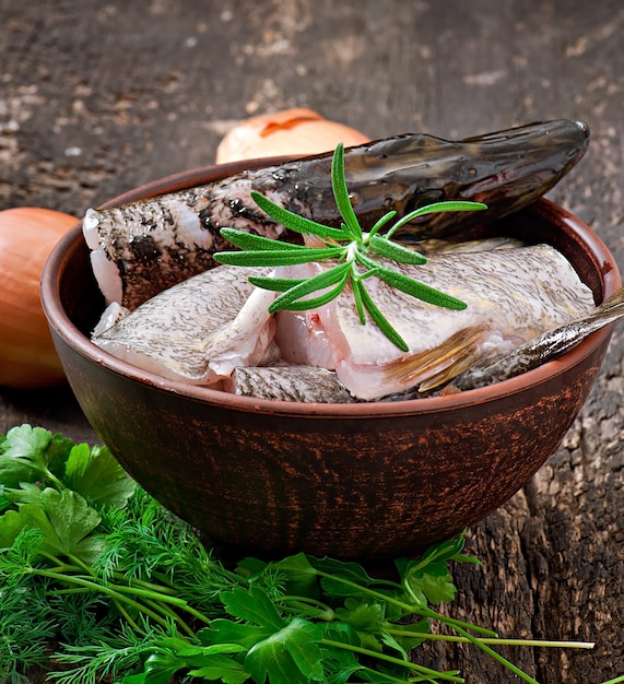 Piece of fresh raw fish in bowl