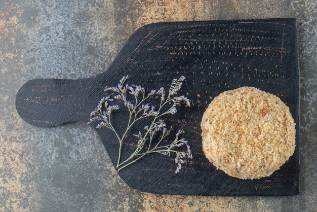 Piece of homemade cake on black board