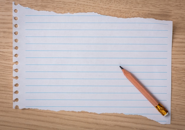 Piece of notebook paper with a pencil