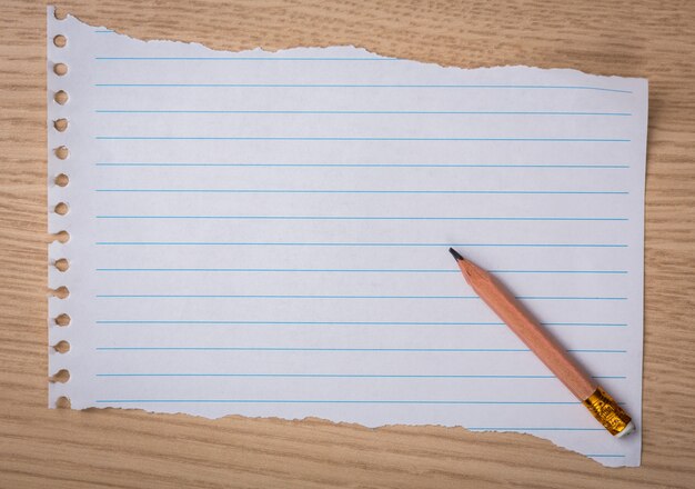 Piece of notebook paper with a pencil