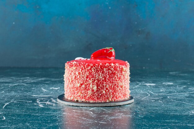 Piece of strawberry cake on marble.