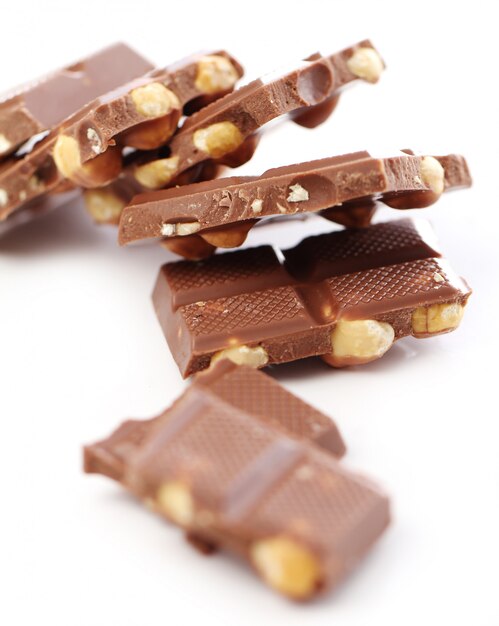 Free photo pieces of milk chocolate with nuts