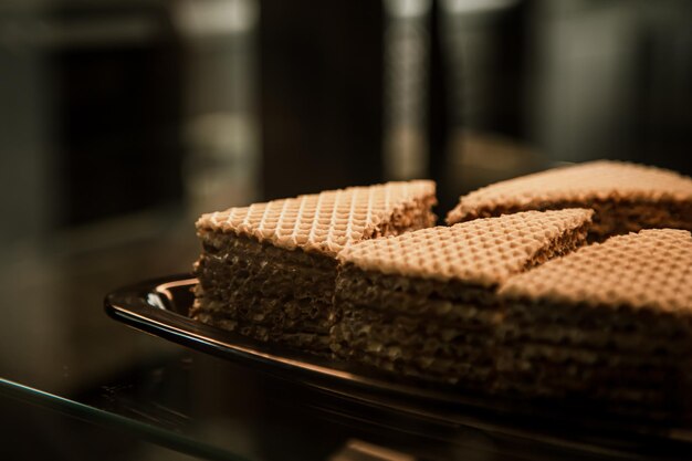 Pieces of waffle cake on display in a cafe