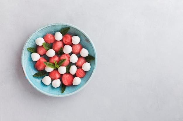 Free photo pieces of watermelon and mozzarella copy space