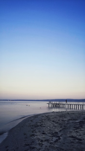 a pier leading to a breathtaking view of the ocean