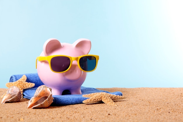 Piggy bank on a beach 