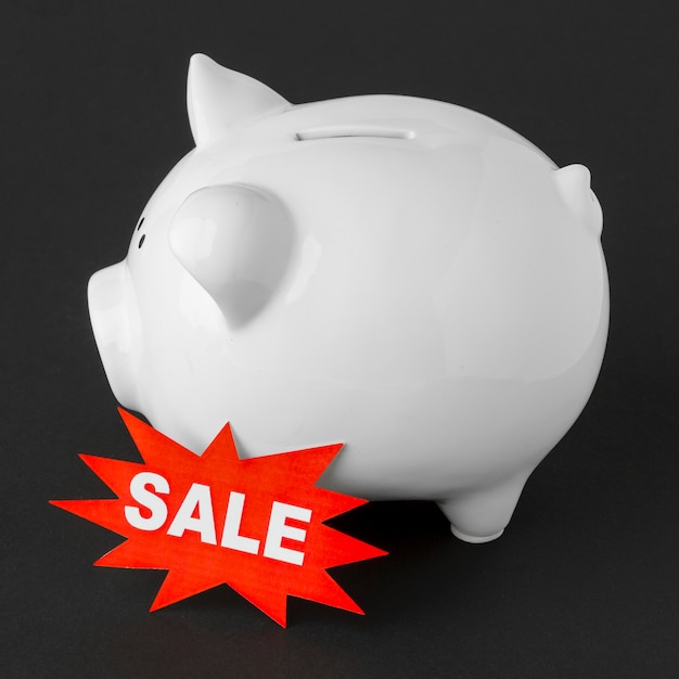 Piggy bank with sale label high view