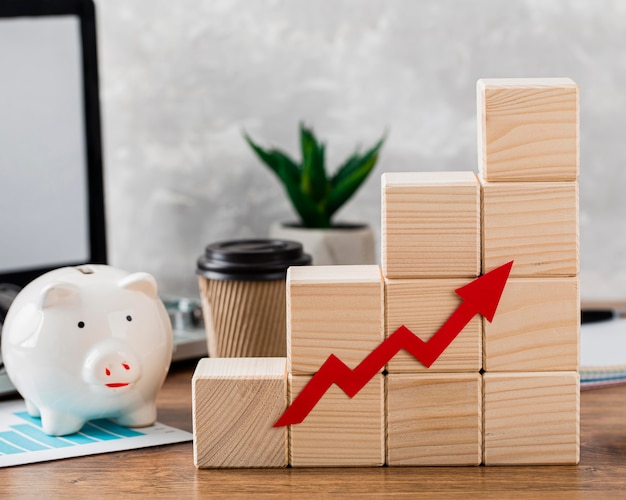 Piggy bank with wooden growth blocks