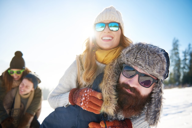 Piggyback in the winter mountain