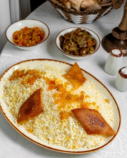 Pilaf served with raisins and ghormeh