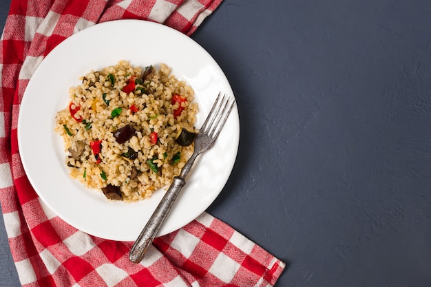 Pilaf with vegetables and greens