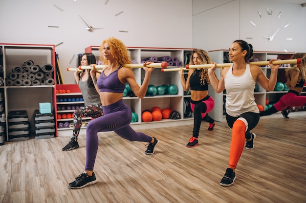 Pilates group working out in a gym