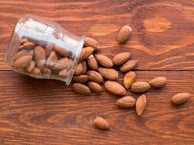 Pile of almonds inside a fallen jar