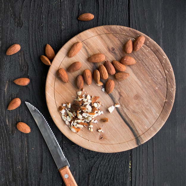 Pile of almonds on wooden tray