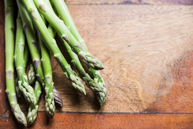 Pile of asparagus sprouts on table