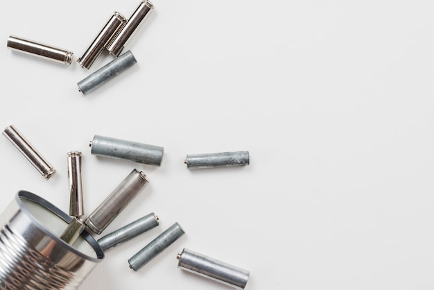 Pile of batteries on grey background