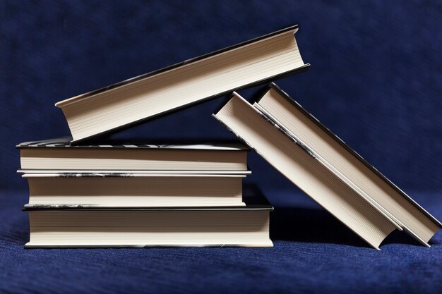 Pile of books on blue background