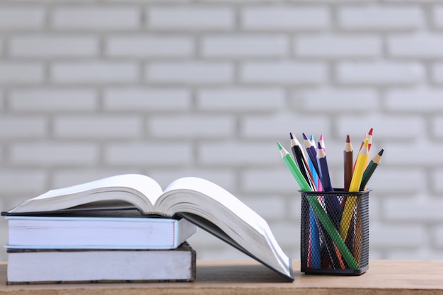 Pile of books and pencils on the desk