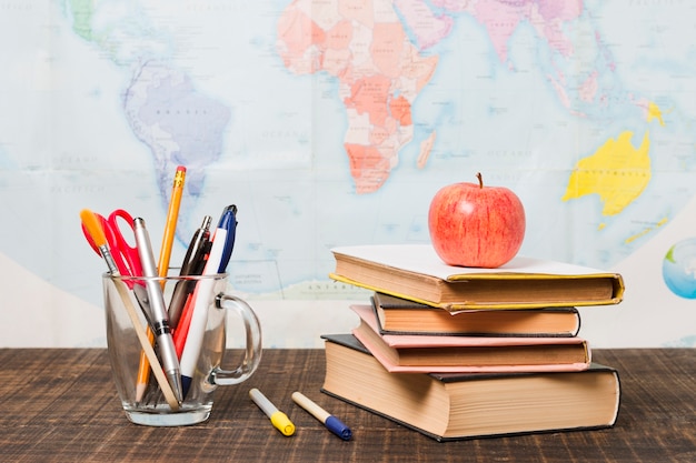 Free photo pile of books and school supplies