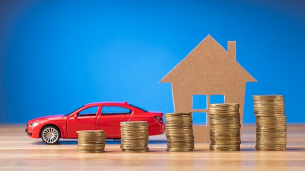 Pile of coins forming a graph next to a car