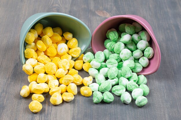 Pile of colorful candies out of ceramic bowls