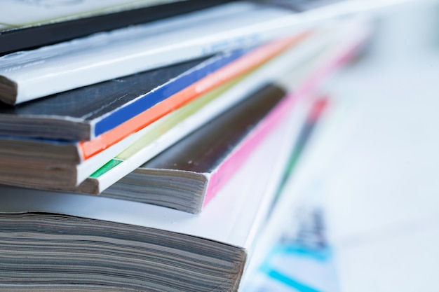 Pile of colorful magazines on a table