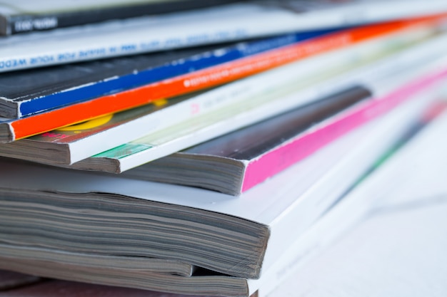 Pile of colorful magazines on a table