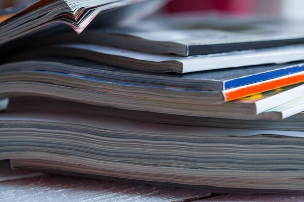 Pile of colorful magazines on a table