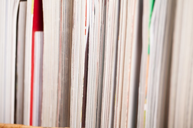 Pile of colorful magazines on a table