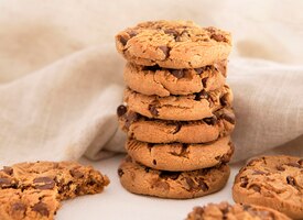 Pile of cookies with chocolate chips in front of cloth