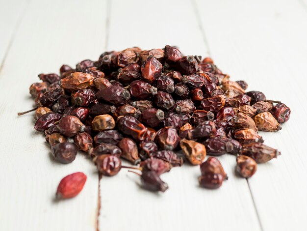 Pile of dry berries on white table