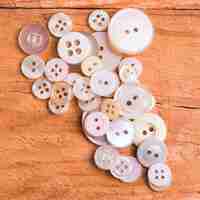 Free photo pile of little white buttons