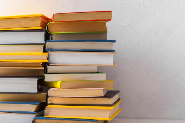 Pile of paperback books on a table